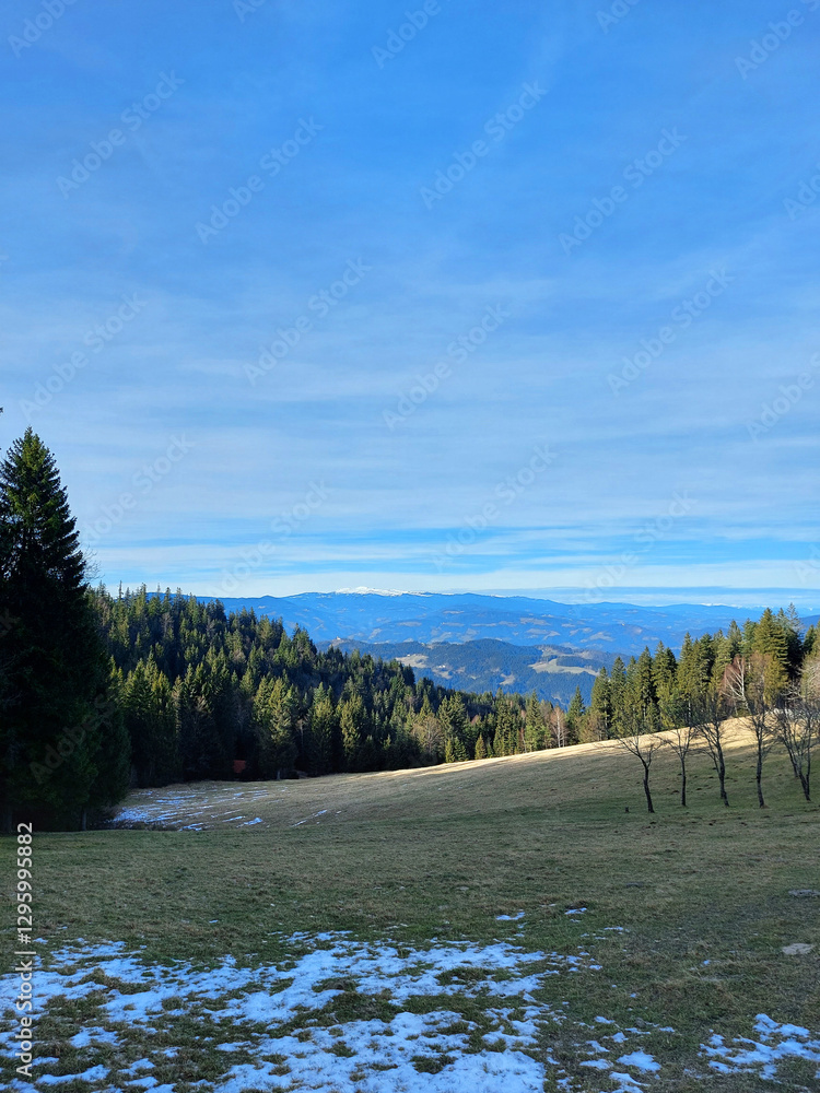 landscape in Slovenia. Pohorje hills at winter season under blue sky