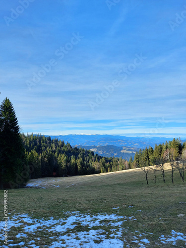 landscape in Slovenia. Pohorje hills at winter season under blue sky