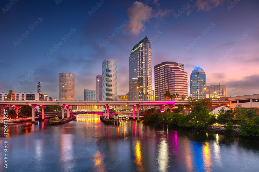 Tampa, Florida, USA. Cityscape image of Tampa, Florida with reflection of the city skyline in the water at beautiful sunrise.