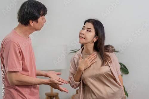 Diverse couple expressing emotions during a conversation in a cozy home office. photo