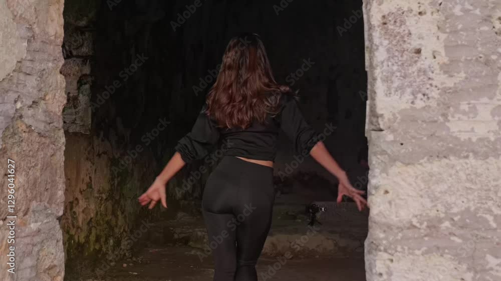 A vlogger dances among the stone walls of a historic and touristic site, recording herself. High ceilings and natural light enhance the atmosphere, adding a unique touch to the vlog.
A vlogger dances among the stone walls of a historic and touristic site, recording herself. High ceilings and natural light enhance the atmosphere, adding a unique touch to the vlog.