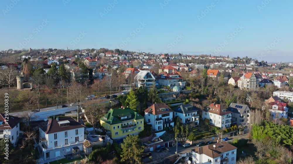 Aerial view of Kriegsberg hill, Stuttgart residential district with colorful buildings and green trees under blue sky Aerial view of Kriegsberg hill, Stuttgart residential district with colorful buildings and green trees under blue sky
