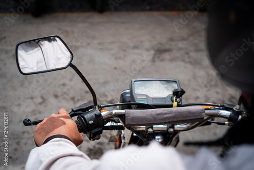 Wallpaper Mural A rider's perspective of a motorcycle, showcasing the handlebars, mirrors, and dashboard, capturing the anticipation of a journey. Torontodigital.ca
