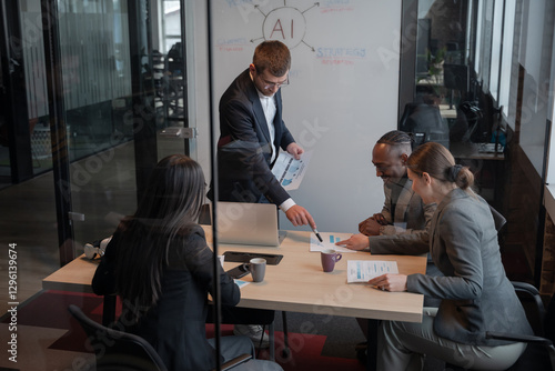 Business team in a modern office discussing data analytics and artificial intelligence. Concept of teamwork, leadership, AI, diversity and corporate strategy in a professional workspace