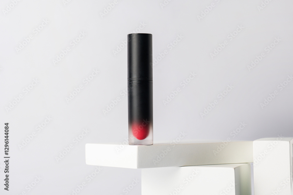 Fototapeta premium Mockup of black blank thin tube - mascara, lip gloss, gel, eyeliner, oil, etc. Cosmetic package with stylish props on white background.