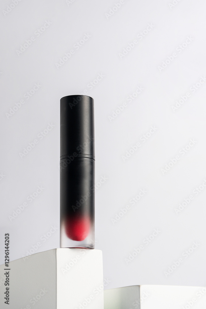 Fototapeta premium Mockup of black blank thin tube - mascara, lip gloss, gel, eyeliner, oil, etc. Cosmetic package with stylish props on white background.