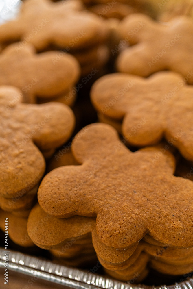 Making Festive Gingerbread Sandwiches on Rustic Wooden Table Making Festive Gingerbread Sandwiches on Rustic Wooden Table