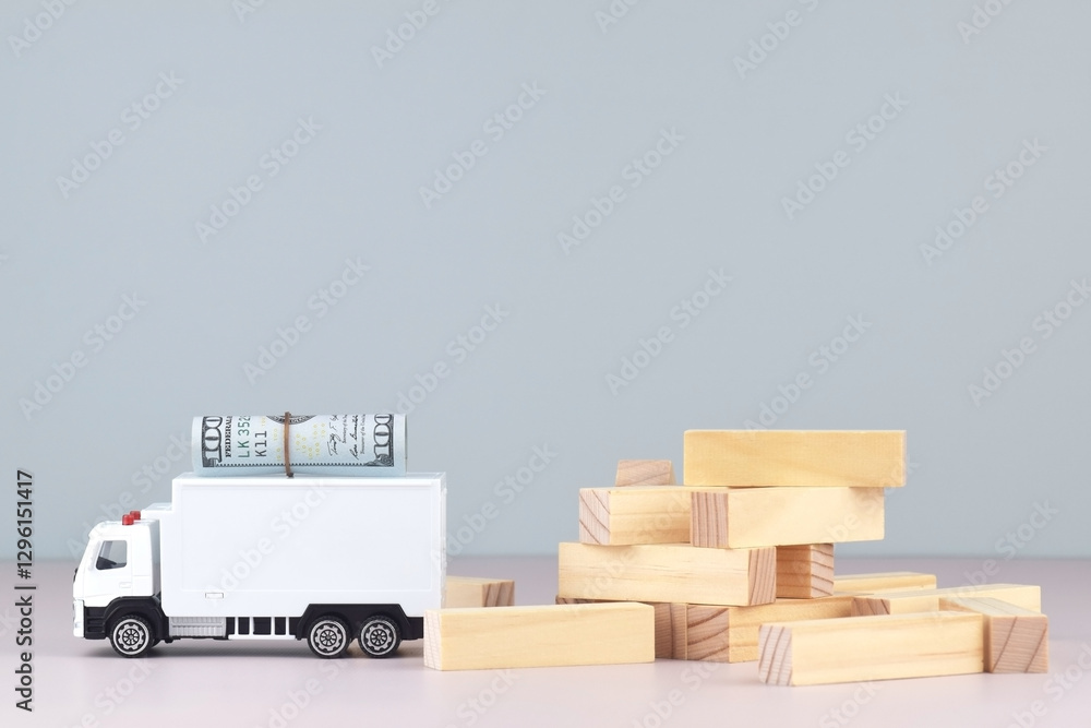 White toy truck with boxes on a light background, space for text. White toy truck with boxes on a light background, space for text.