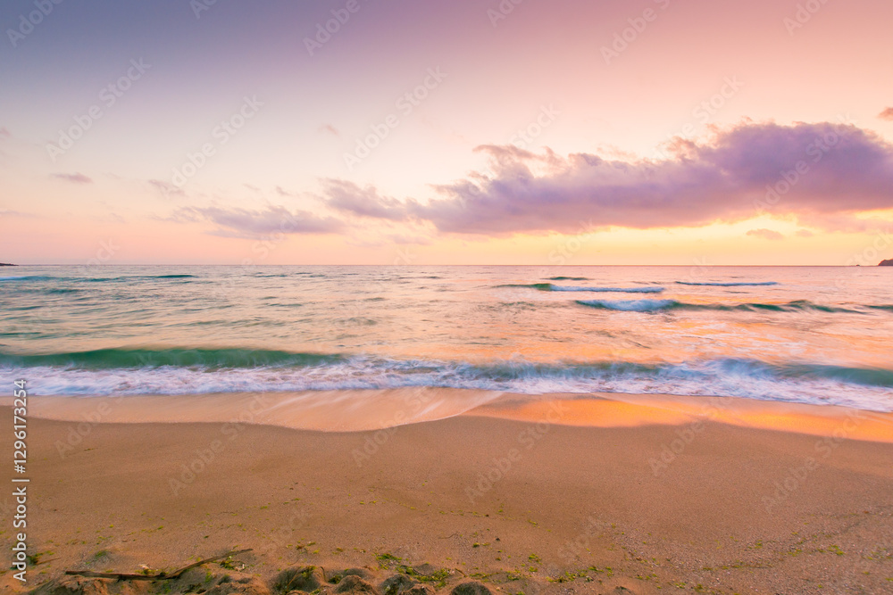 summer vacation at the sea. sunny environment. beautiful purple pink seascape at sunrise. calm waves wash the golden sandy beach. fluffy clouds on the sky. orange morning light summer vacation at the sea. sunny environment. beautiful purple pink seascape at sunrise. calm waves wash the golden sandy beach. fluffy clouds on the sky. orange morning light