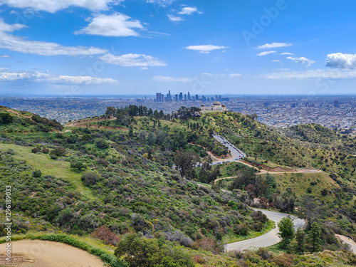 Fototapete Scenic view of LA downtown city skyline, Griffith Observatory and hiking trails on the hills