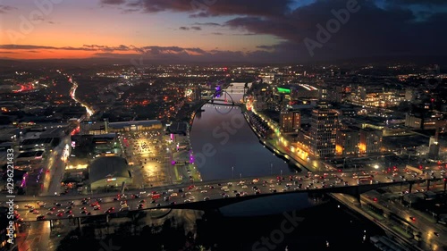 Sunset night aerial city Glasgow Scotland and river Clyde rush hour traffic