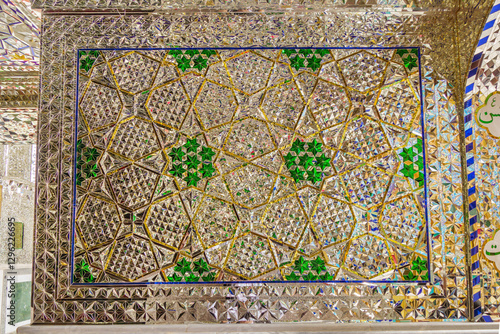 Mirror wall of intricate geometric patterns in the shrine of a Shiite saint or imam. Shot in the shrine of Imamzadeh Mohammed Helal, Aran va Bidgol, Iran
