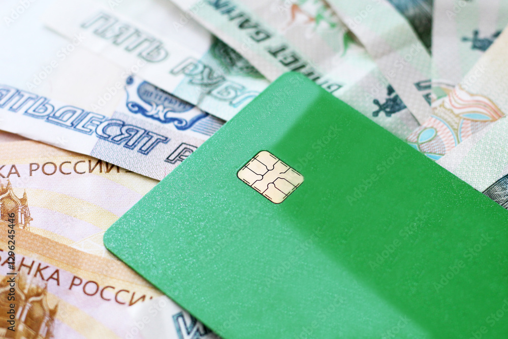 Obraz premium Green bank card and Russian cash
