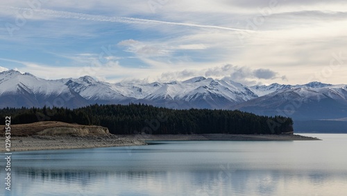 A wintry view looking across Lake Pukaki with snow-capped mountains in the distance