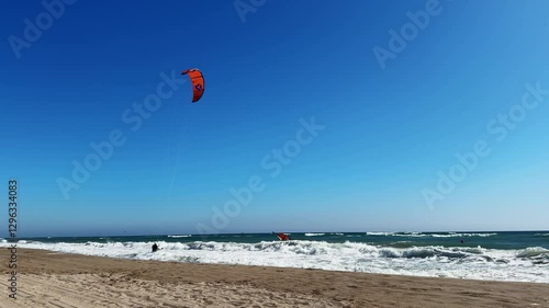 Sky Surfing in windy weather. Kiteboarding in the sea. High quality 4k footage
