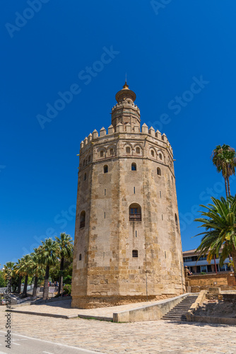 Obraz na płótnie Seville, Spain - August 01, 2024: Torre del Oro Tower of Gold in Seville w salonie