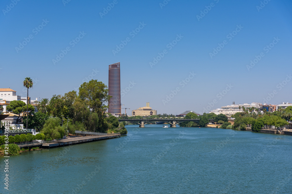 Seville, Spain - August 01, 2024: Guadalquivir river cityscape, Seville, Spain