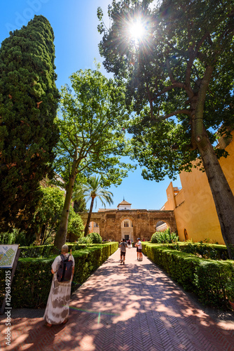 Obraz na płótnie Sevilla, Spain - August 01, 2024: Patio de las Doncellas in Royal palace, Real Alcazar (built in 1360) in Seville, Andalusia, Spain. The Alcázar of Seville, officially called Royal Alcázar of Seville, w salonie