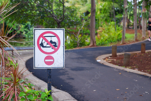 No Golf Car Symbol Sign. A sign prohibiting vehicles in the area on the jogging track or running track
