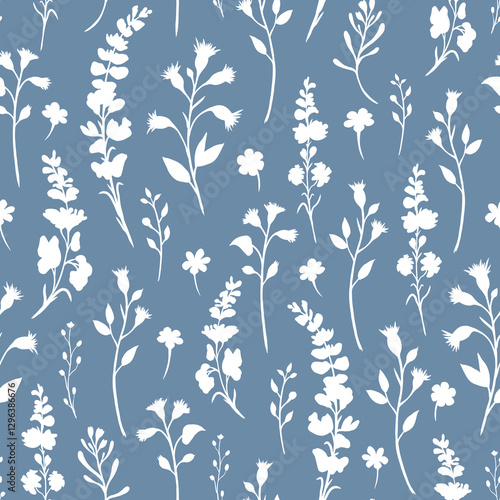 White seamless pattern of silhouettes of wildflowers and their leaves lying vertically on a blue background