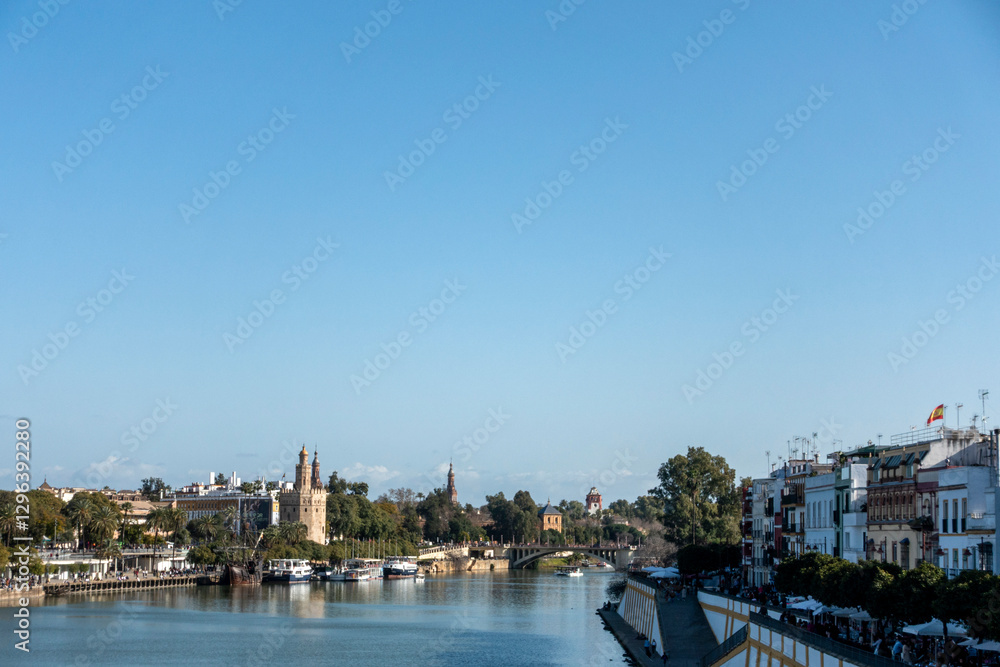 Obraz premium View of Seville and the Guadalquivir River from the Triana Bridge. Andalusia, Spain.