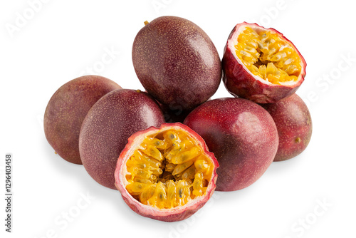 Group or pile of whole and sliced in half ripe raw juicy passion fruit or maracuya with edible yellow pulpy sour seeds isolated on white background used as healthy antioxidant vegetarian dessert 