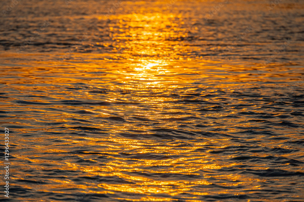 A serene, tranquil sunset scene over a calm water body, captured during the golden hour with no clouds A serene, tranquil sunset scene over a calm water body, captured during the golden hour with no clouds
