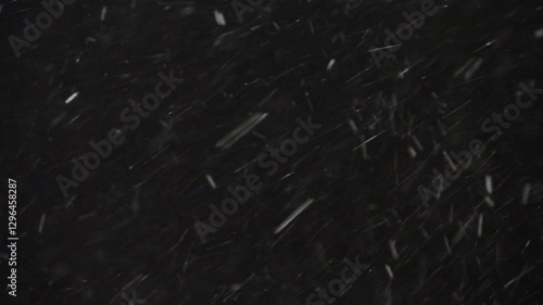 A Real Snowstorm With Intense Winds, Snowflakes Flying Quickly Against A Black Background. Perfect For Winter Weather Effects, Green Screen Usage, Or Adding A Snowstorm Element To Your Visuals.