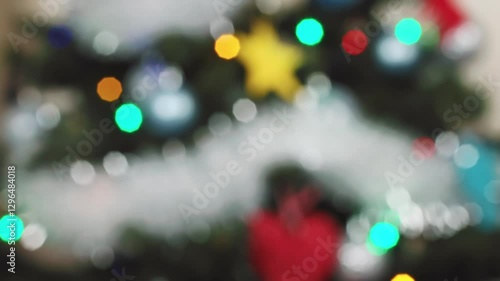 Wallpaper Mural view of glowing Christmas tree lights in vibrant colors, focusing on their twinkling effect, evoking holiday Torontodigital.ca