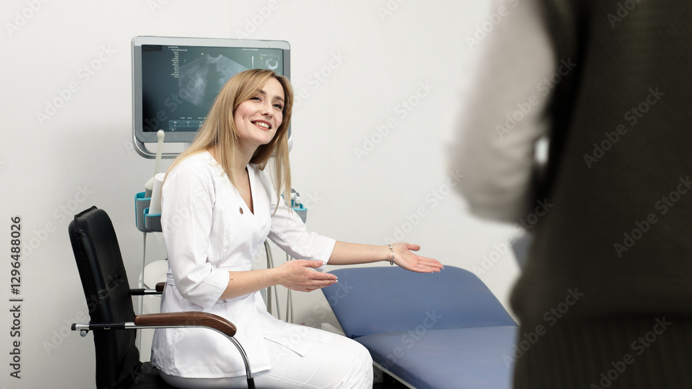 Fototapeta premium An ultrasound specialist consults a patient about the procedure in a modern office near the ultrasound machine. The concept of advanced technology and a professional approach in medical diagnostics.