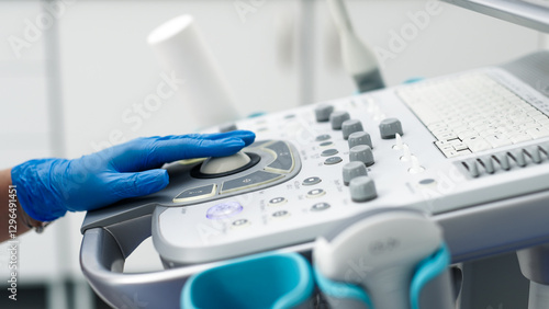 Close-up of ultrasound equipment with a probe in a modern diagnostic center. The concept of precision and advanced technology in professional medicine.