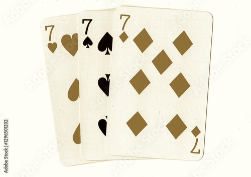 Vintage playing cards showing three of the same value in sepia. photo