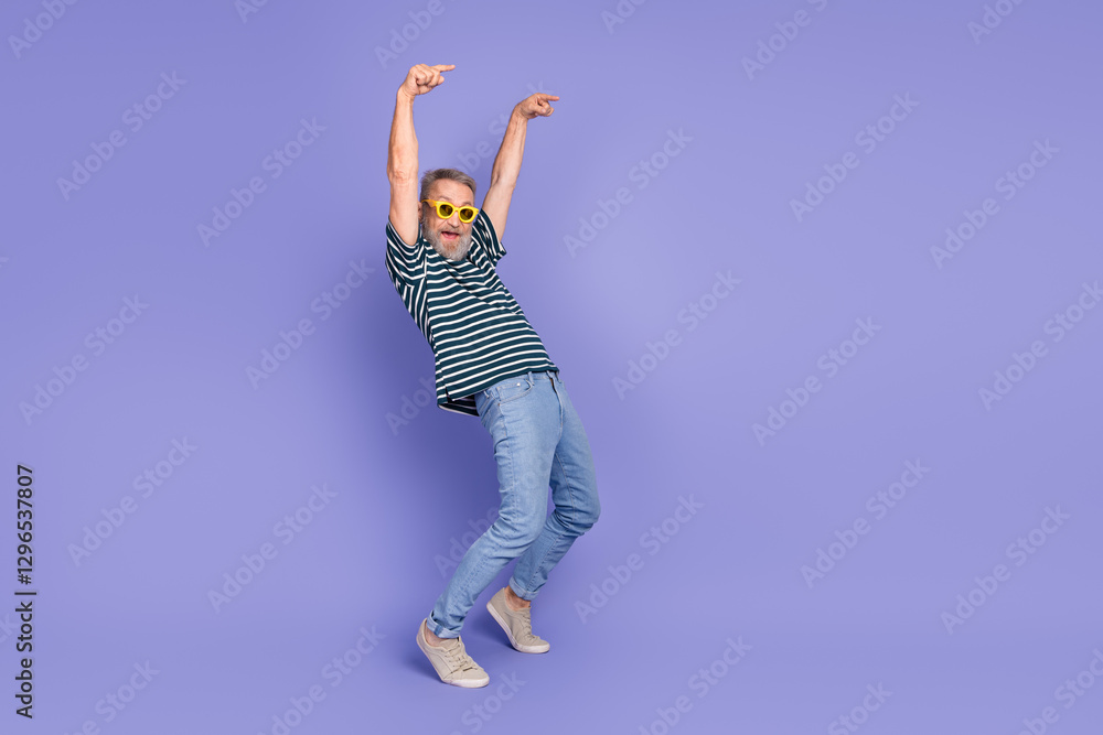 Stylish elderly man in striped shirt enjoying a cheerful moment against a vibrant purple background, showing the joy of lifestyle Stylish elderly man in striped shirt enjoying a cheerful moment against a vibrant purple background, showing the joy of lifestyle