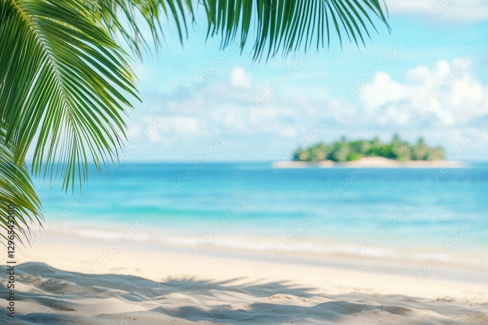 Obraz premium Tropical beach background with palm leaves and sand, a banner for a summer vacation concept. Shallow depth of field with blurred seawater in the foreground and an island on the horizon. Bright, sunny 