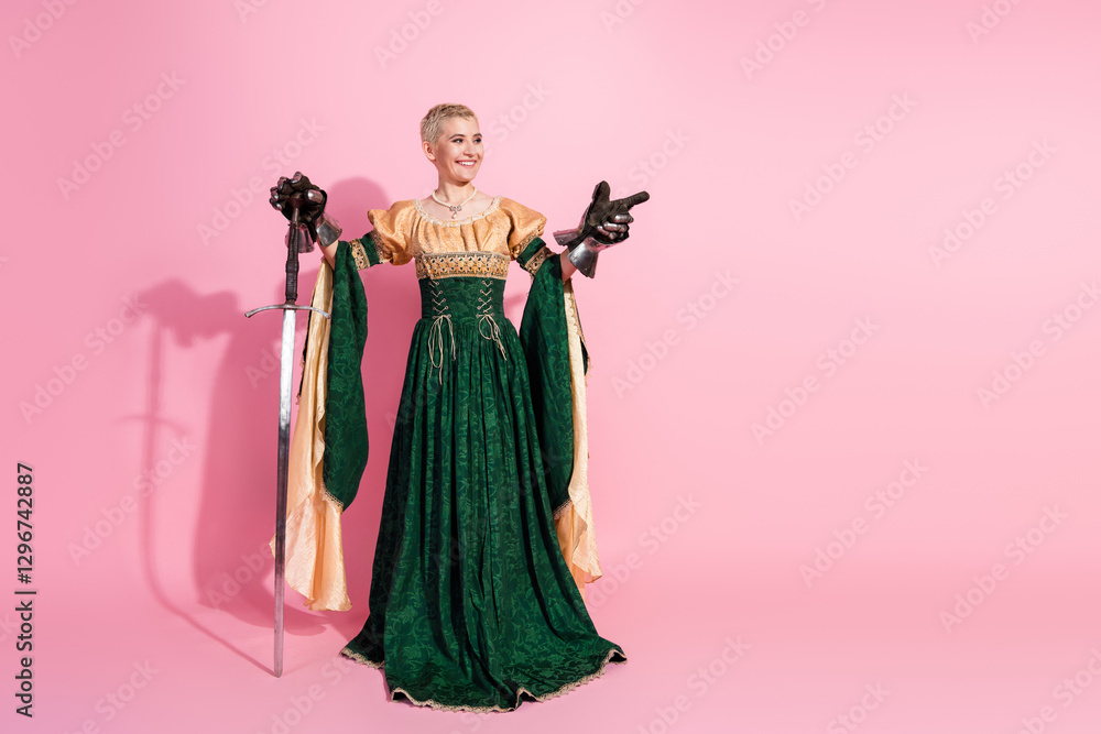 Fototapeta premium Elegant woman in medieval costume with sword against pink background
