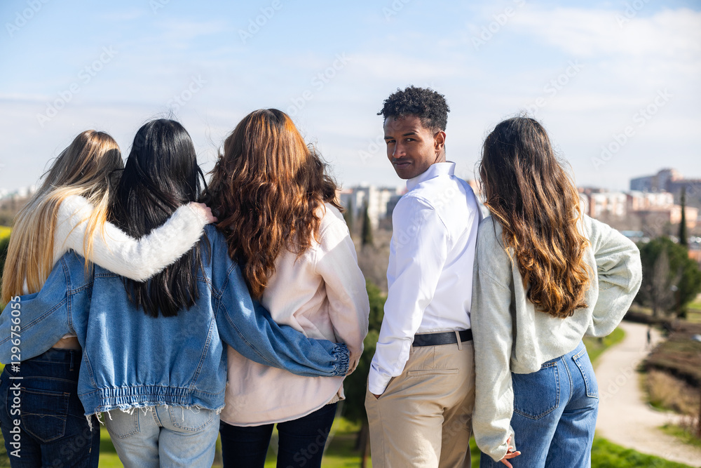 Group of diverse friends enjoying scenic view in urban park Group of diverse friends enjoying scenic view in urban park