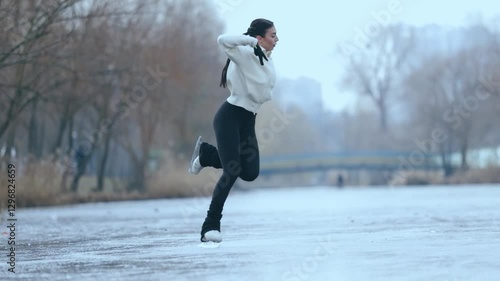 Figure skater girl on winter lake.