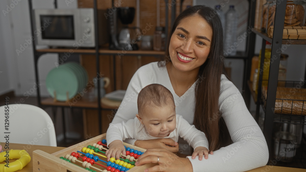 Obraz premium Woman smiling with baby playing in living room interior showcasing family love and togetherness.