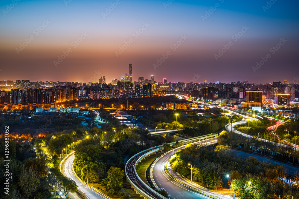Fototapeta premium The road shining with brilliant lights in the urban night view of Beijing, China