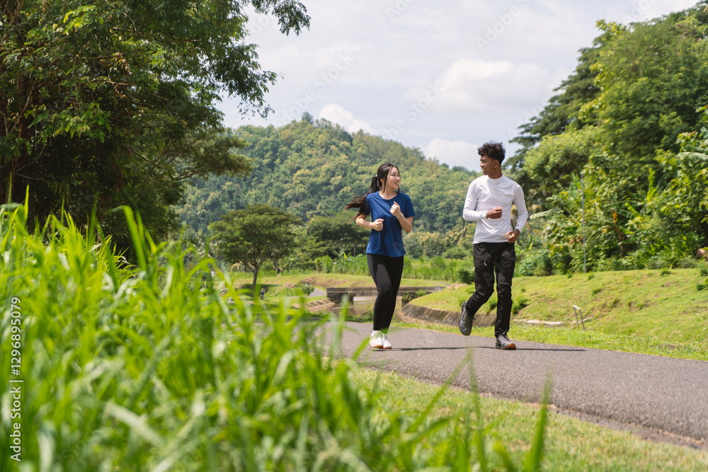 active asian young couple jogging and running exercise at rural area active asian young couple jogging and running exercise at rural area