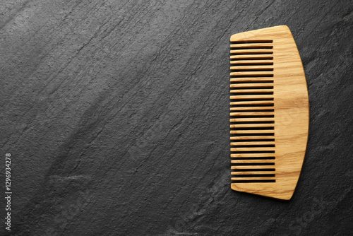 Photos One wooden hair comb on grey background, top view. Space for text