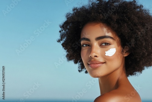 Wallpaper Mural sunscreen cream on the cheek of woman, summertime, closeup, sun protection, skincare Torontodigital.ca