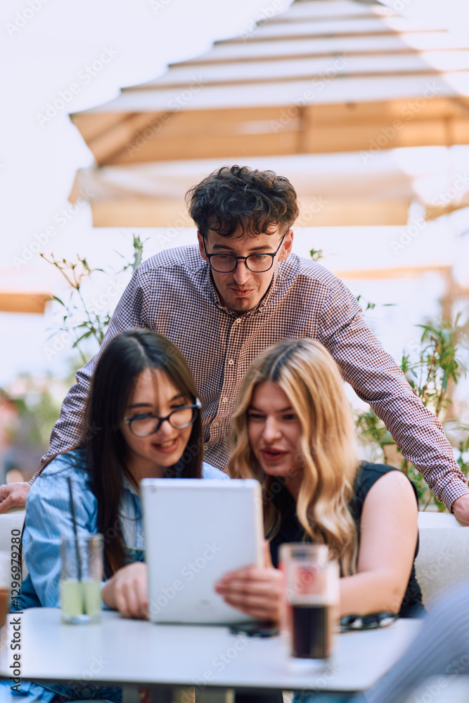 A Diverse MultiEthnic Group Reviewing Projects During a Work Break in a Caffee. A Diverse MultiEthnic Group Reviewing Projects During a Work Break in a Caffee.