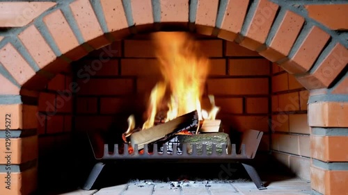Warm Fire in Brick Fireplace: Perfect for Cozy Evenings