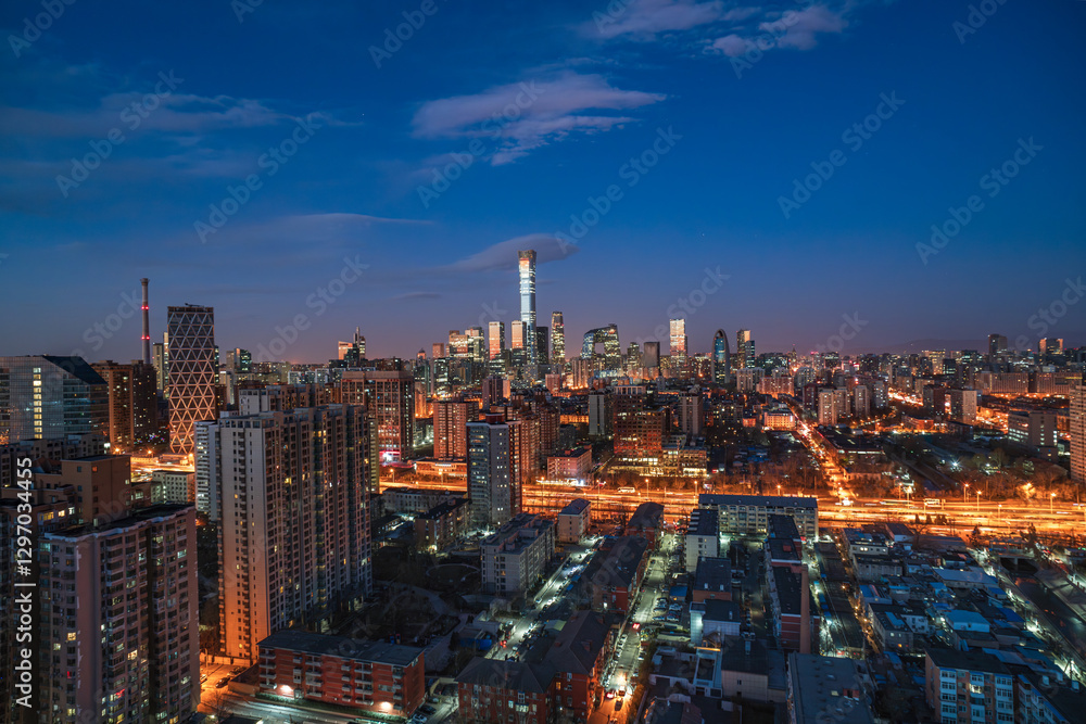 Obraz premium Overlooking the bustling night view of the metropolis in Beijing, China, with the city brightly lit up