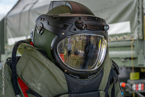 Fényképezés Bomb disposal technician protective helmet with visor during preparation for exp