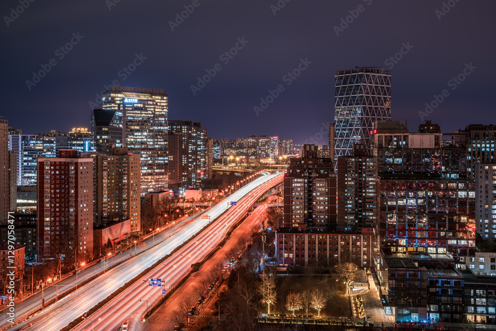 Obraz premium The resplendent and colorful urban roads and tall buildings in Beijing, China under the night view