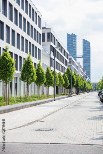 Row of trees in front of business center. Munich, Germany