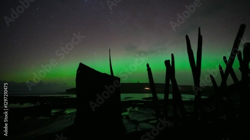 Northern lights on the marwick shore with  the shipwreck of the monamoy, 4k time lapse photo