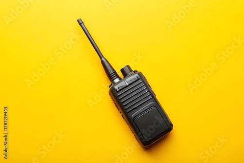 motorola two-way radio, with antenna on solid yellow background